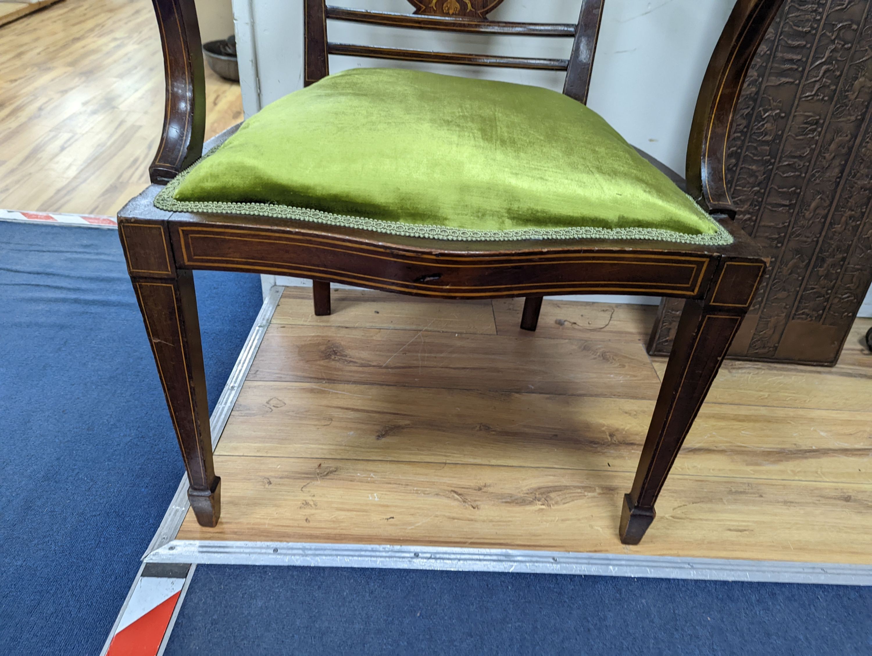 An Edwardian marquetry inlaid mahogany elbow chair